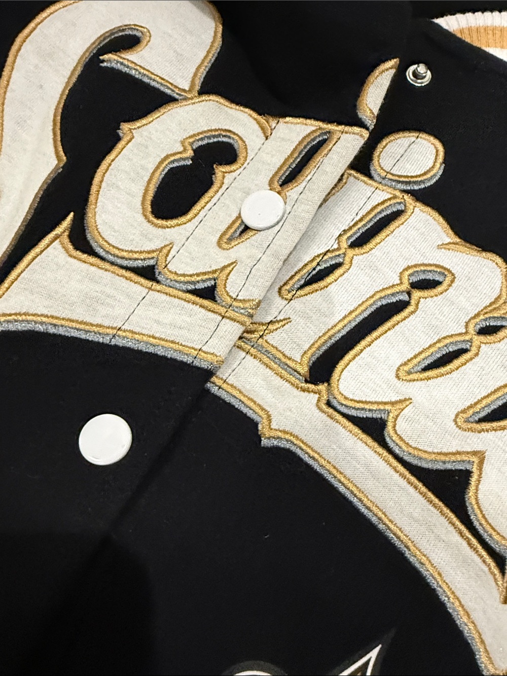 NFL Saints Black White and Gold Varsity Jacket - Picture 3 of 5